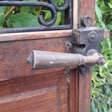 Porte d’entrée vitrée en chêne et grilles en fer, XIXème s.