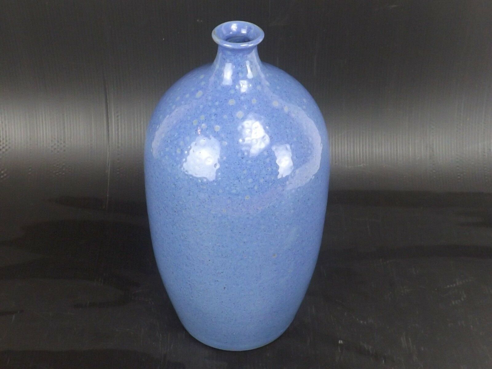 Signed enamelled terracotta bottle vase