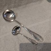 2 Silver-plated soup and sauce ladles with rocaille ribbon decoration