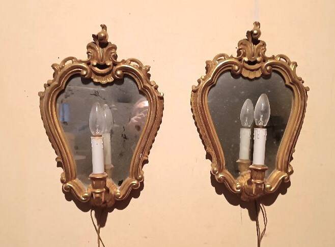 Vintage gold mirror sconces from the late 1950s.
