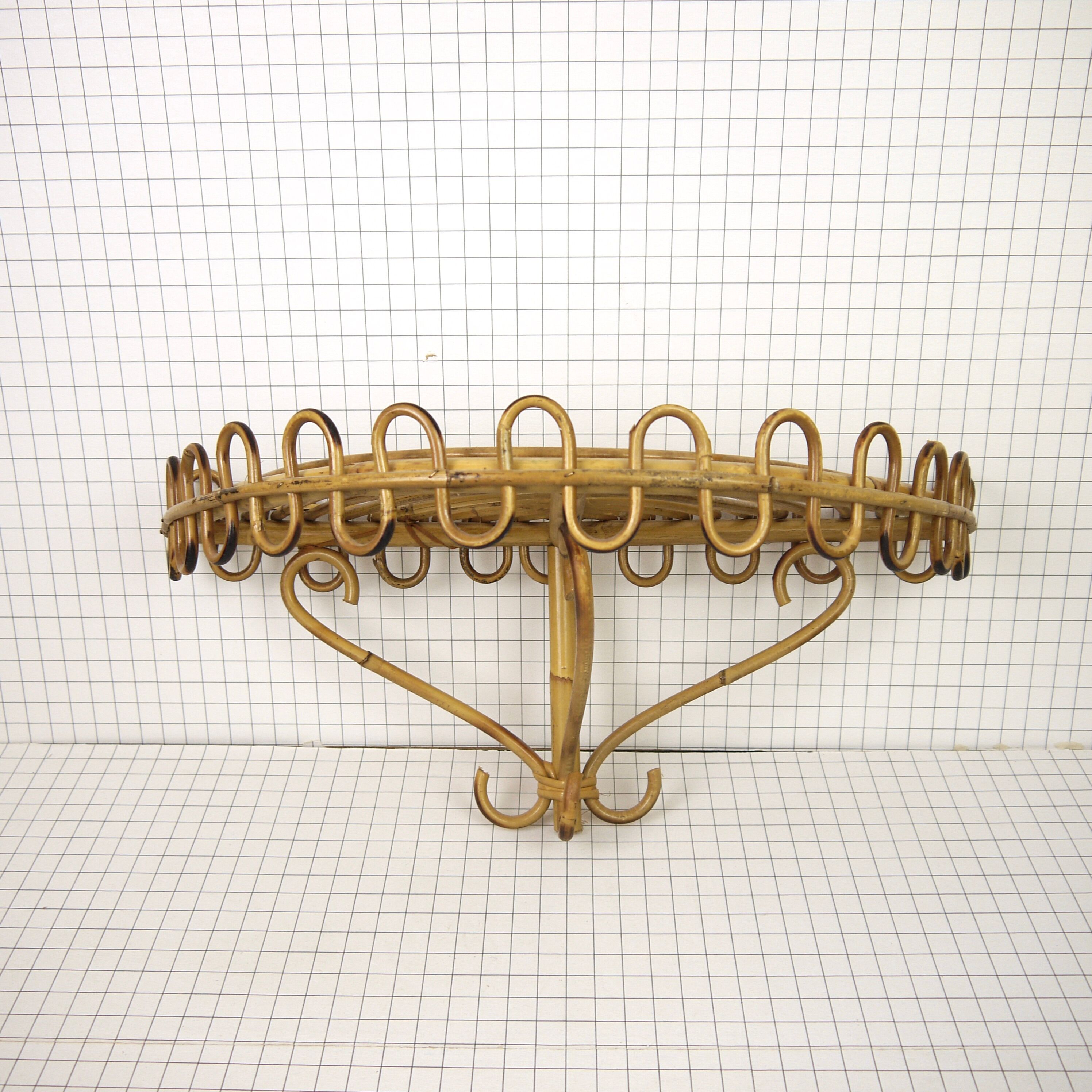 Half-moon rattan shelf and coat holder