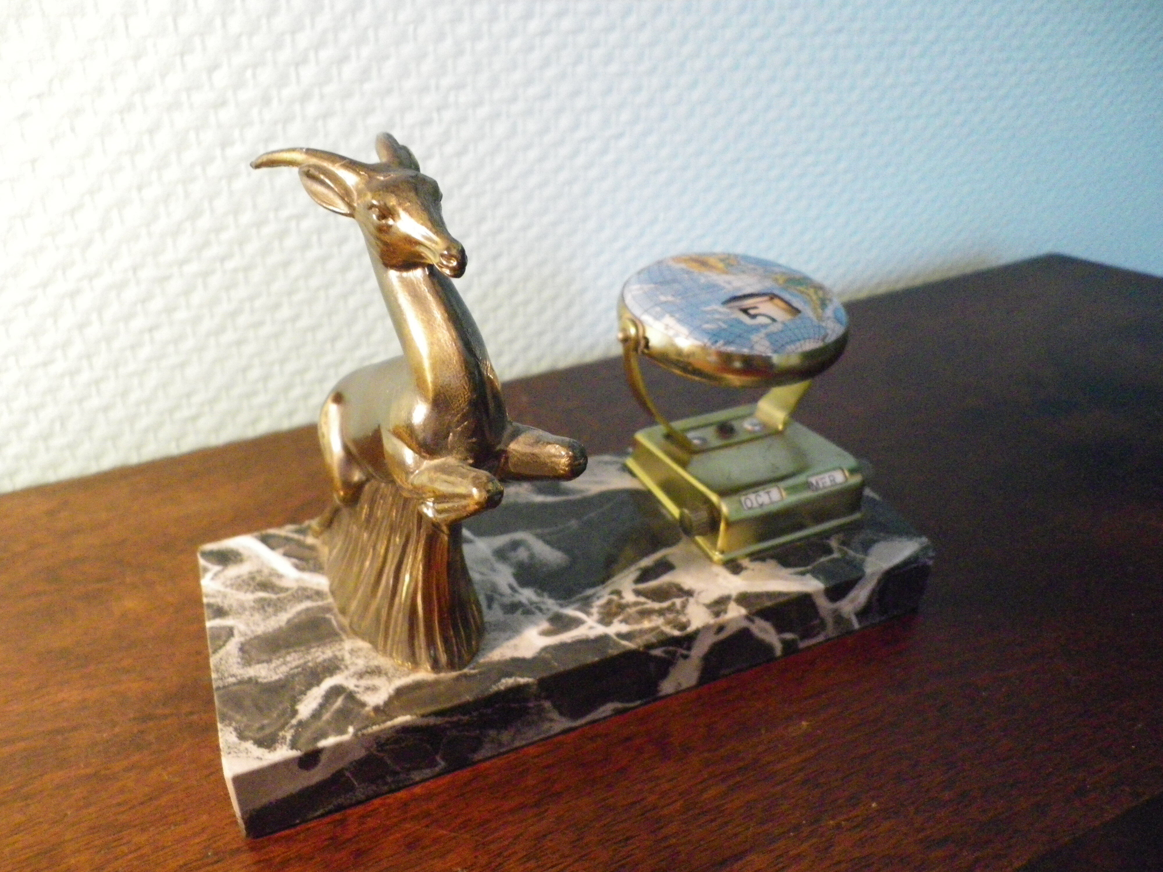 Perpetual calendar on marble base with marble patinated regulated decoration, 60s