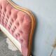 antique wooden and fabric headboard
