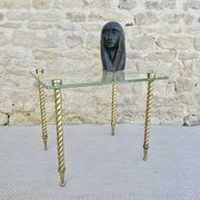 End of sofa, glass and twisted legs in gilded metal