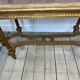 Banquette cannée dorée de style Louis XV