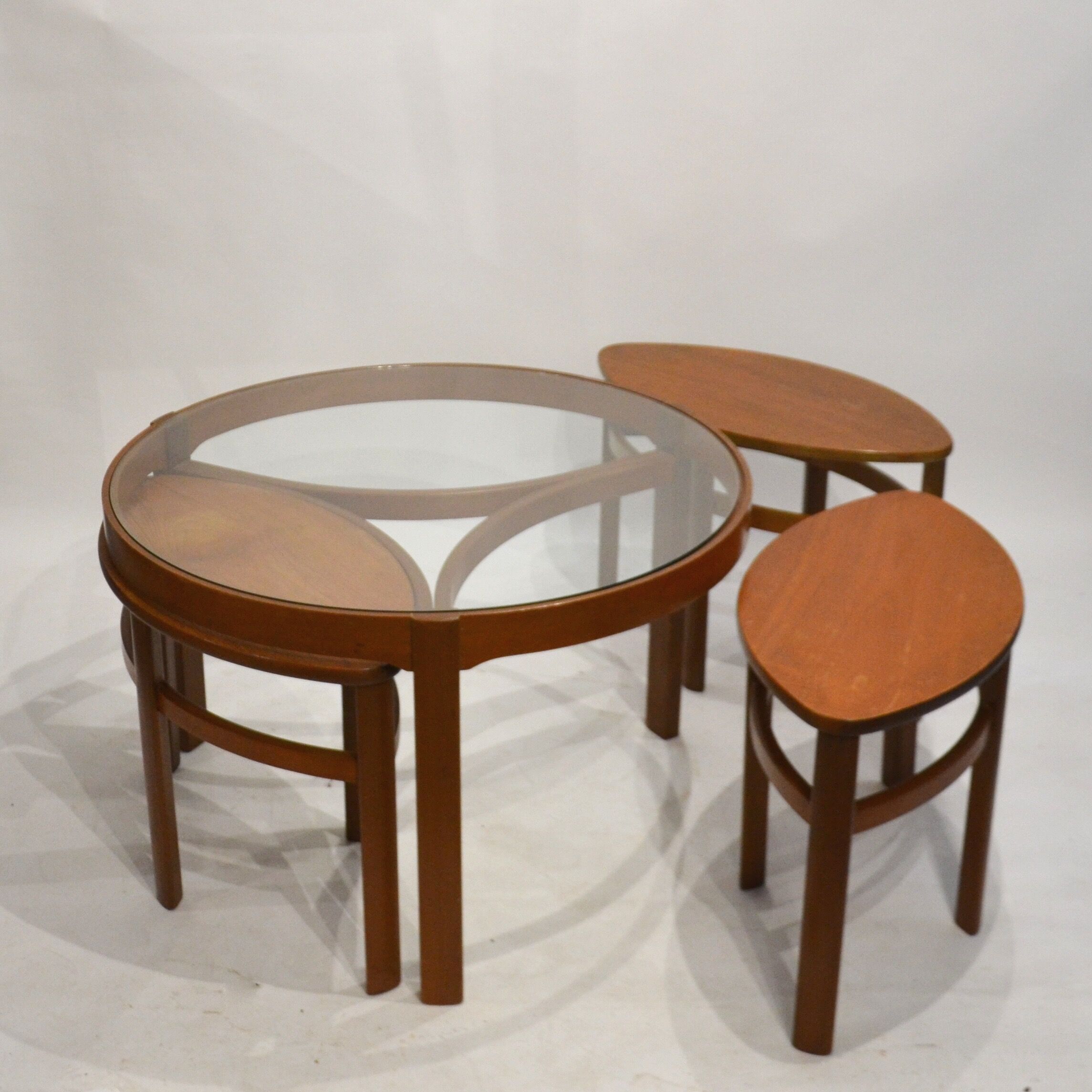 Glass and teak pull out coffee tables