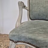Louis XV style cabriolet armchair in patinated wood and velvet