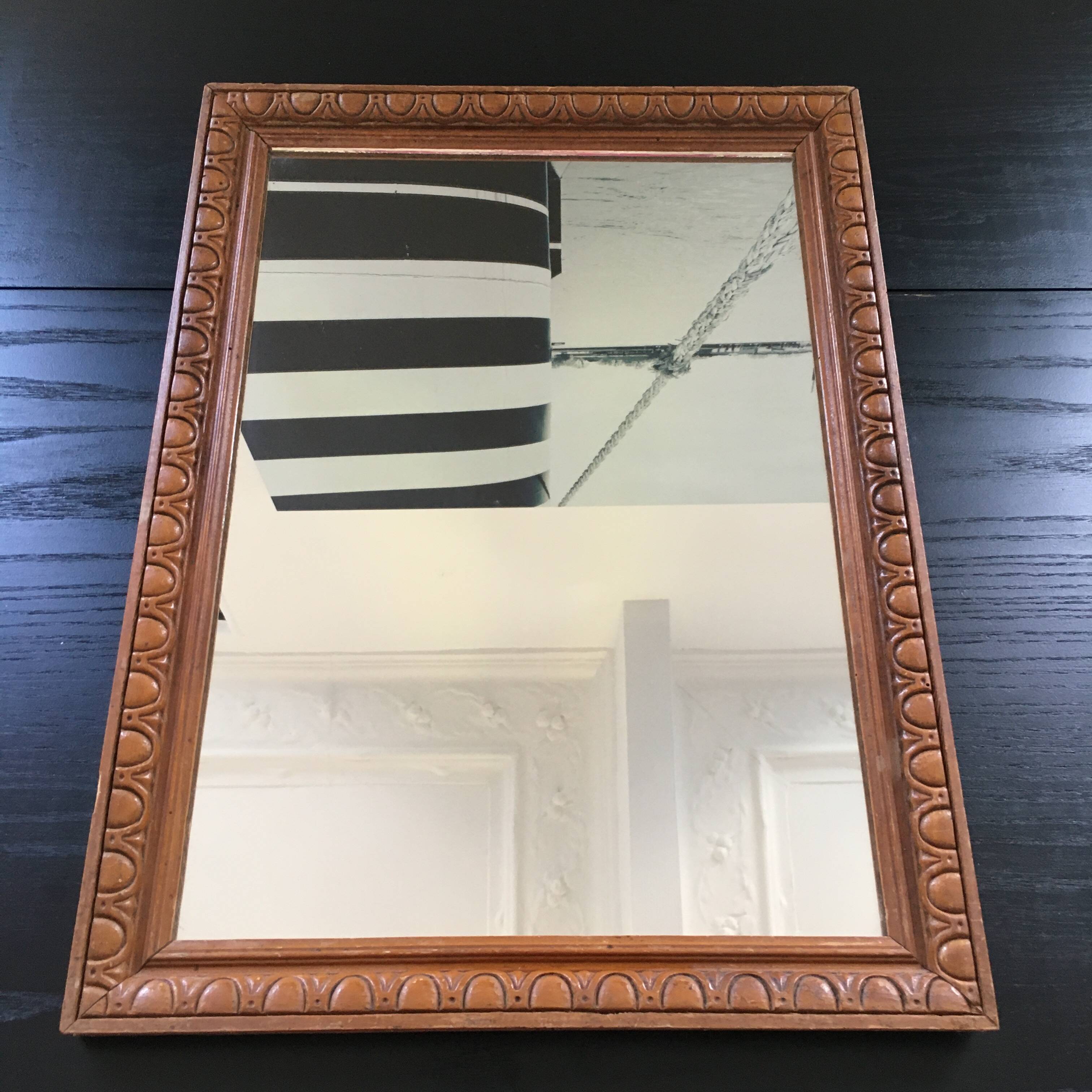 Antique mirror in ornate wood