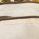 Round cotton tablecloth from the Swedish brand Almedahls. Vintage yellow and green flower patterns.