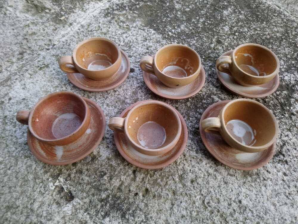 6 stoneware coffee cups and saucers