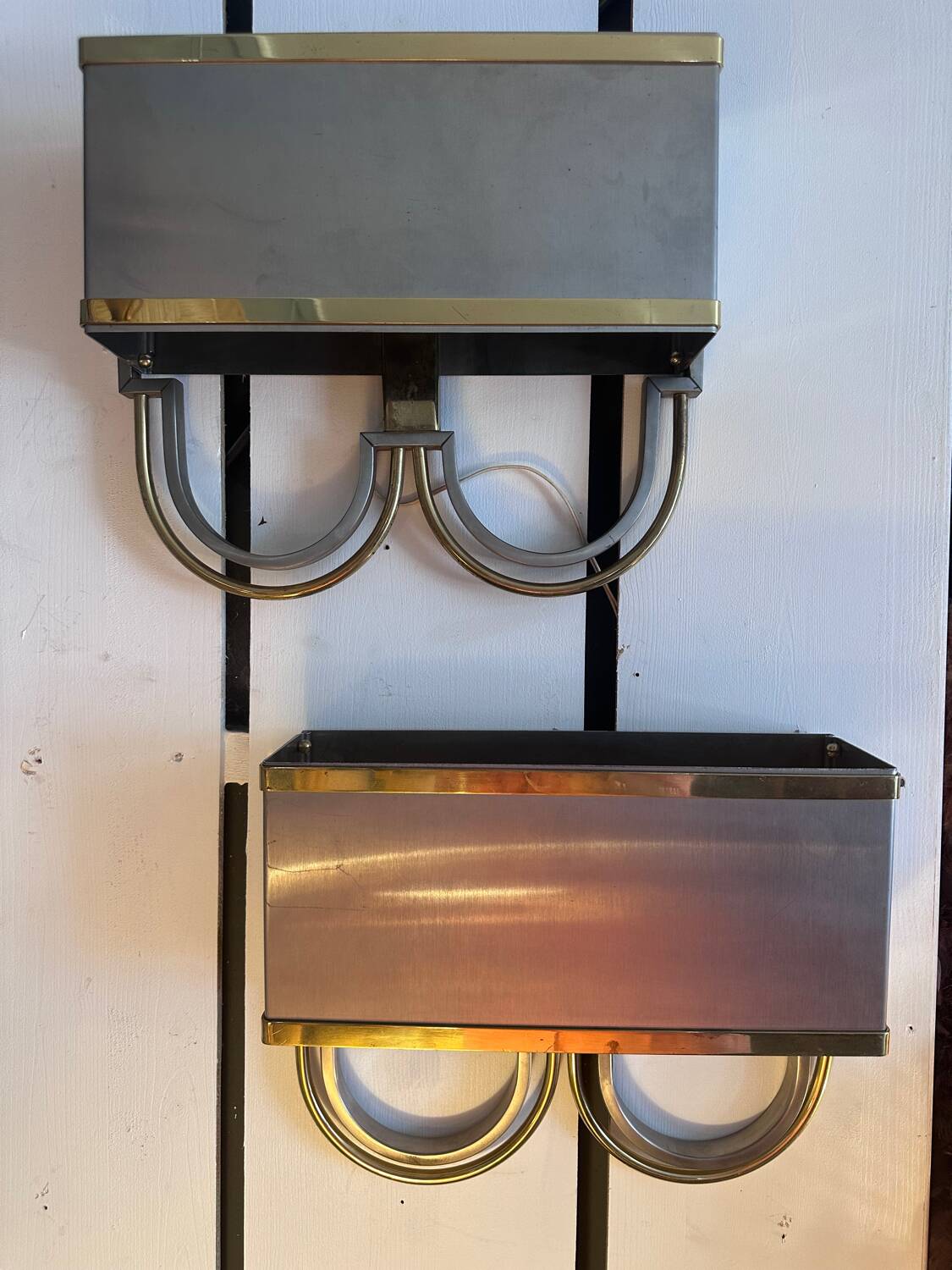 Pair of stainless steel and brass wall lights