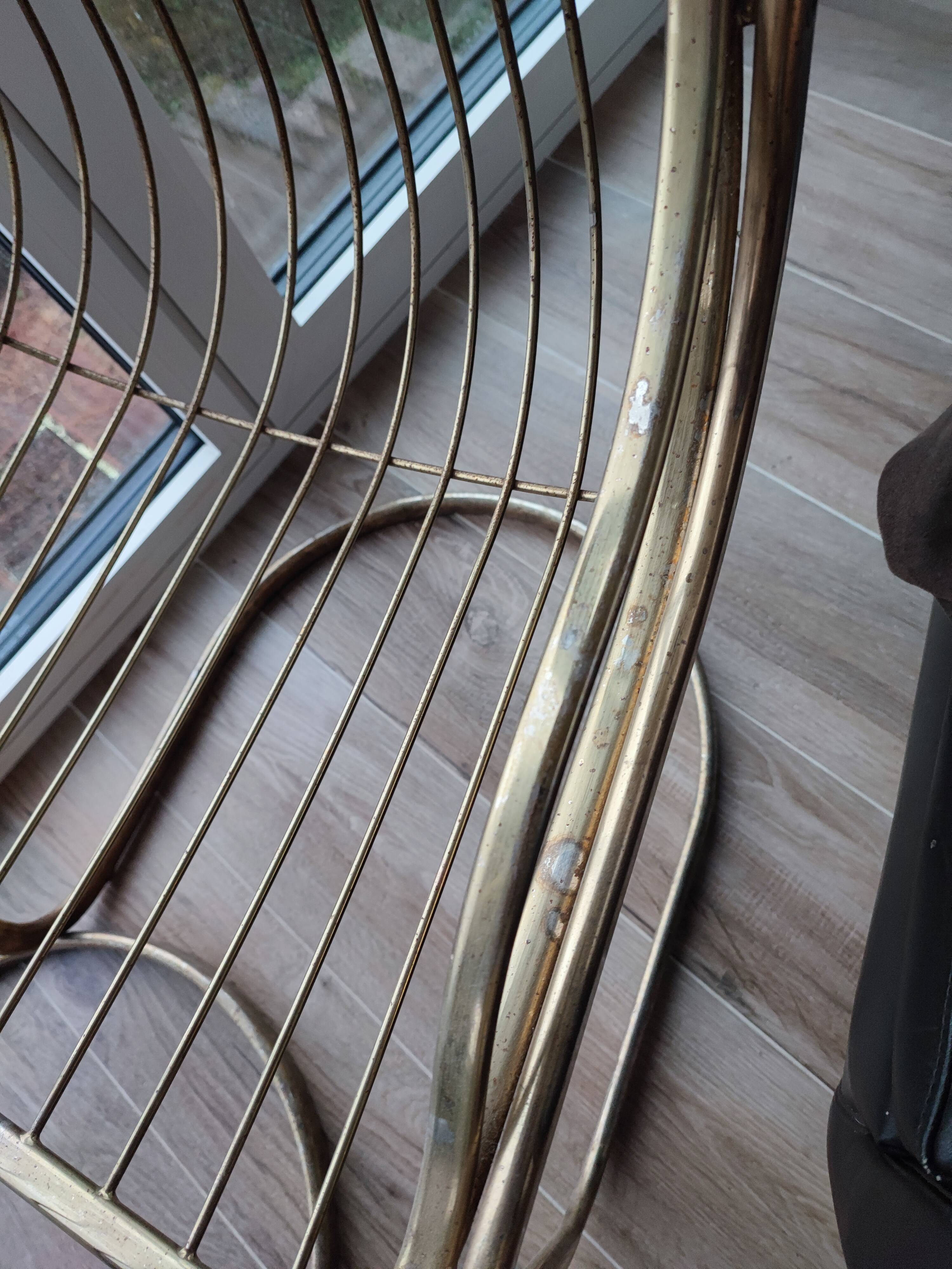 Tubular metal chair covered with gilding