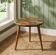 Round resin coffee table with a natural edge.