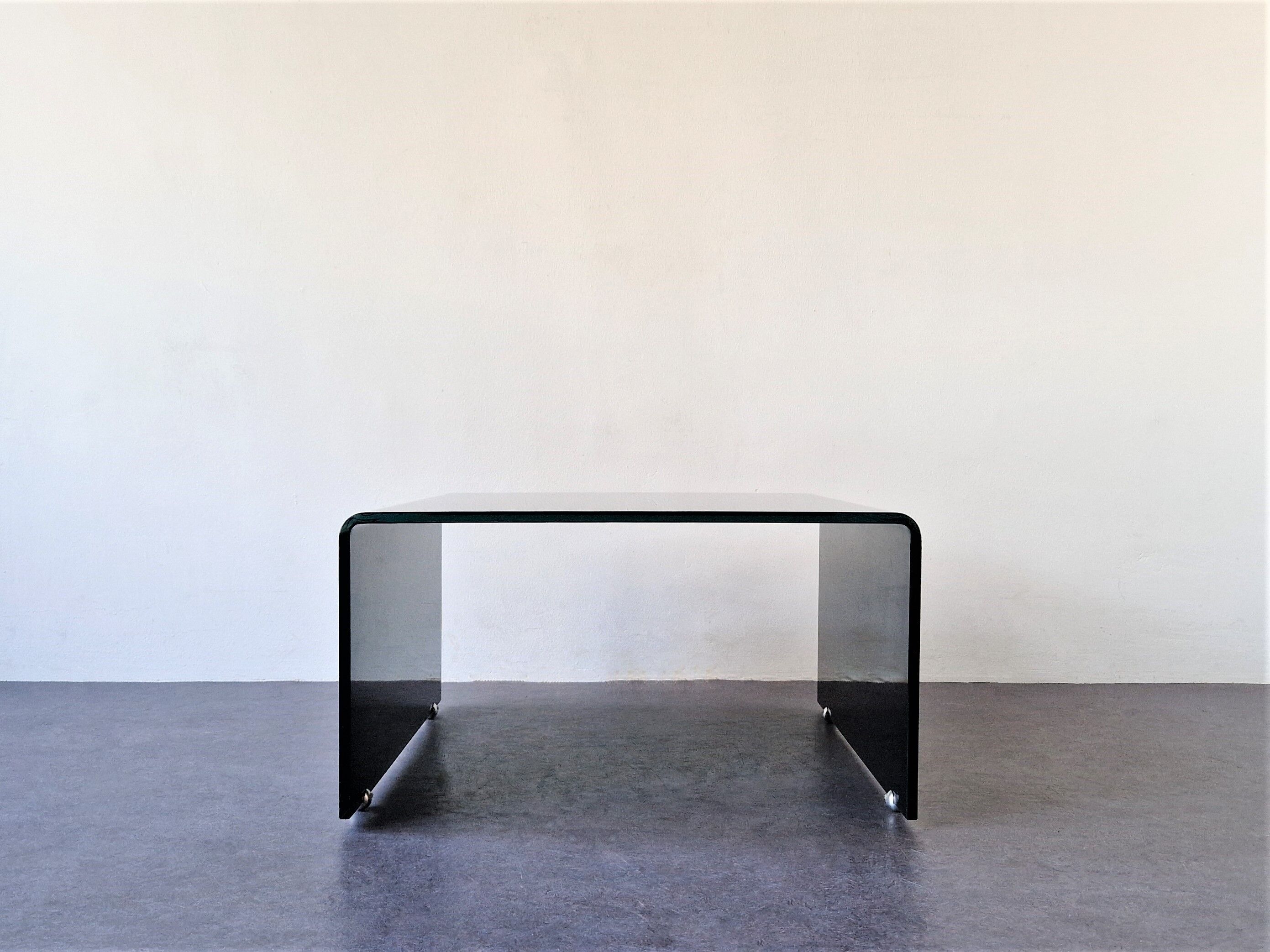 Bended black glass coffee table