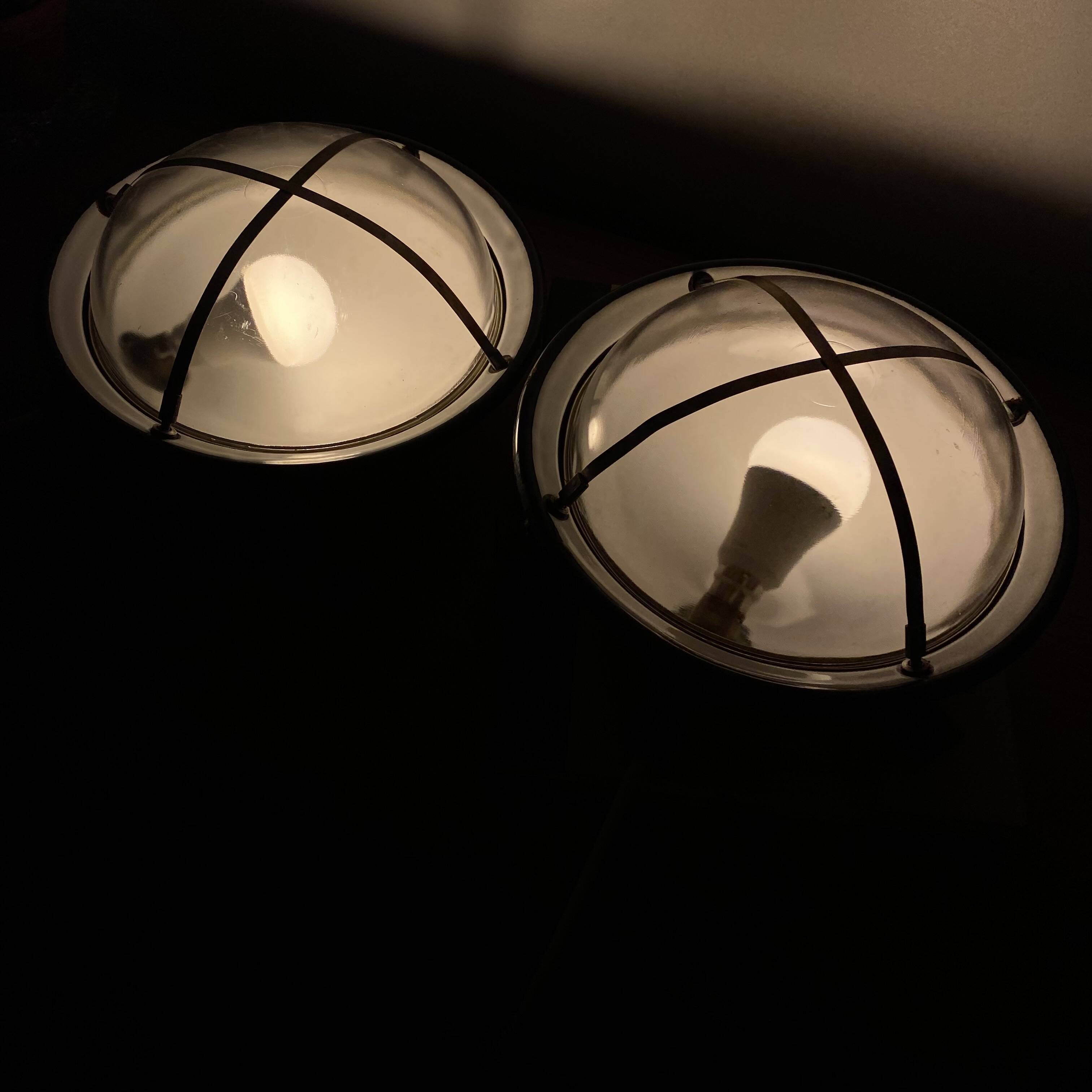 Pair of vintage industrial wall sconces or ceiling lights in enamelled sheet metal.