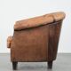 Vintage sheepskin club armchair with character and a beautiful patina