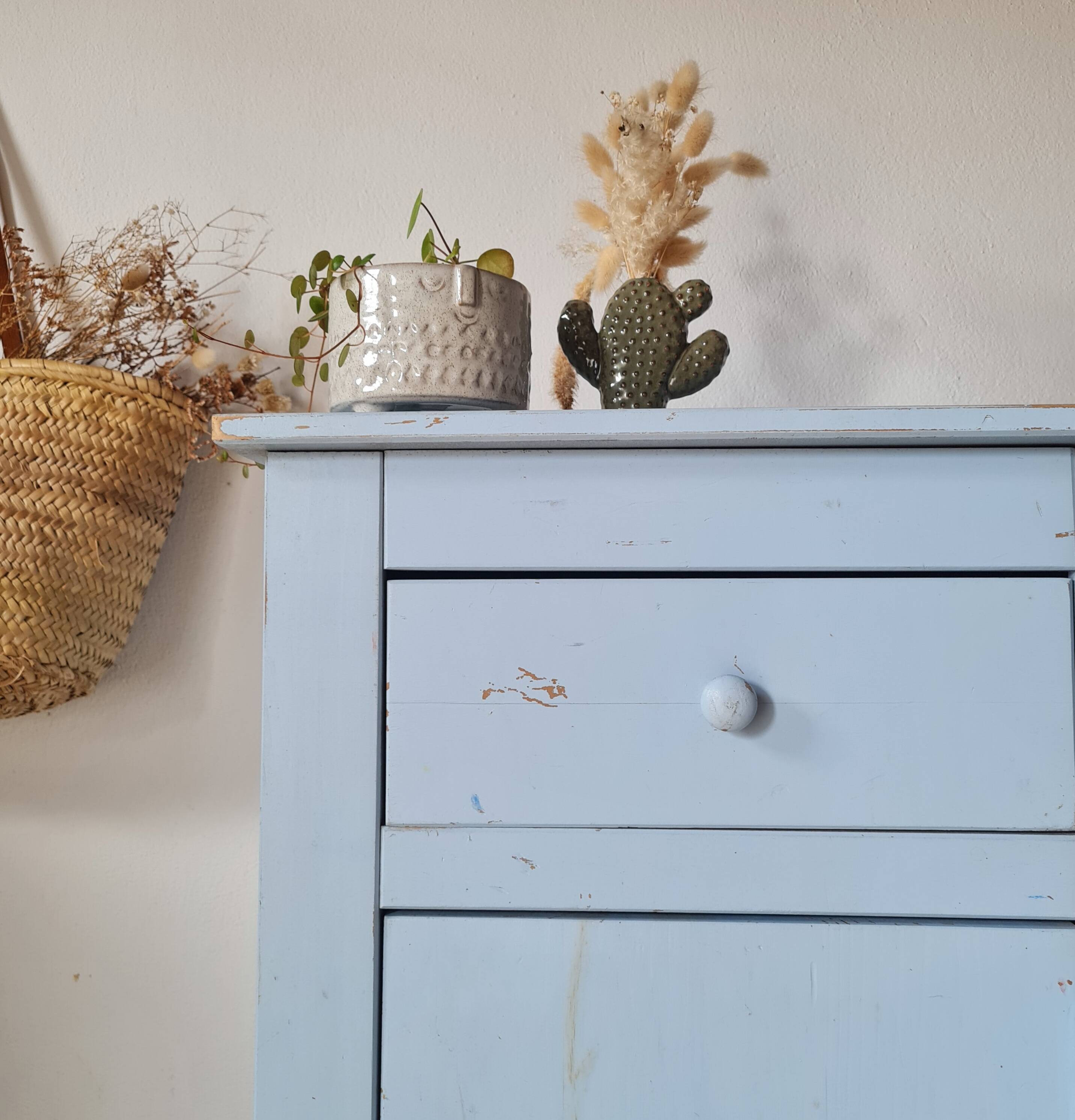 Handcrafted blue chest of drawers.