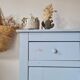 Handcrafted blue chest of drawers.