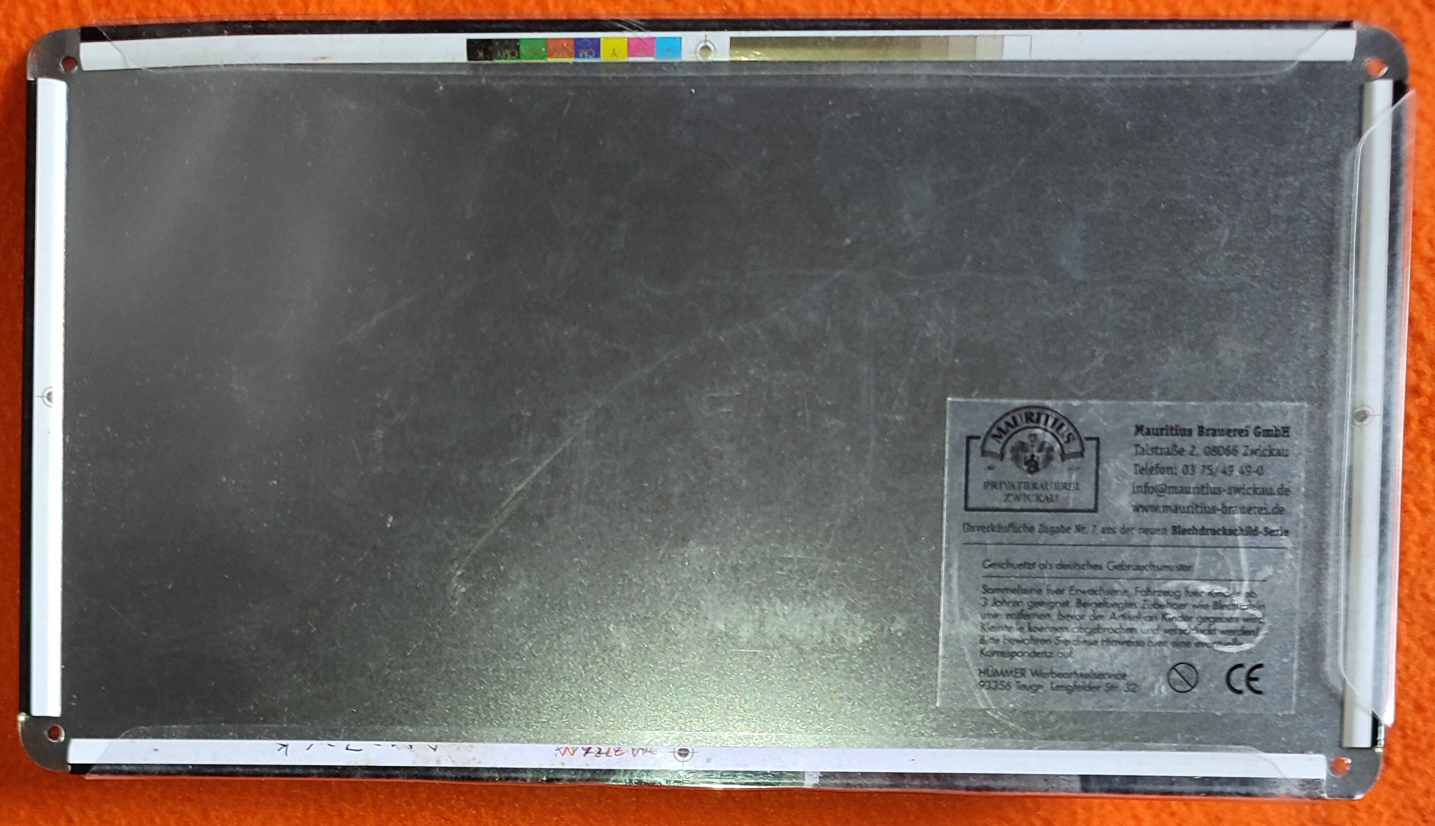 Mercedes flatbed containing drums pulling 1 trailer carrying 1 covered vehicle