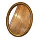 Old oval mirror in gilded wood from the 20th century