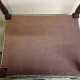 Antique Louis XIV style armchair in moulded wood and damask-style fabric.