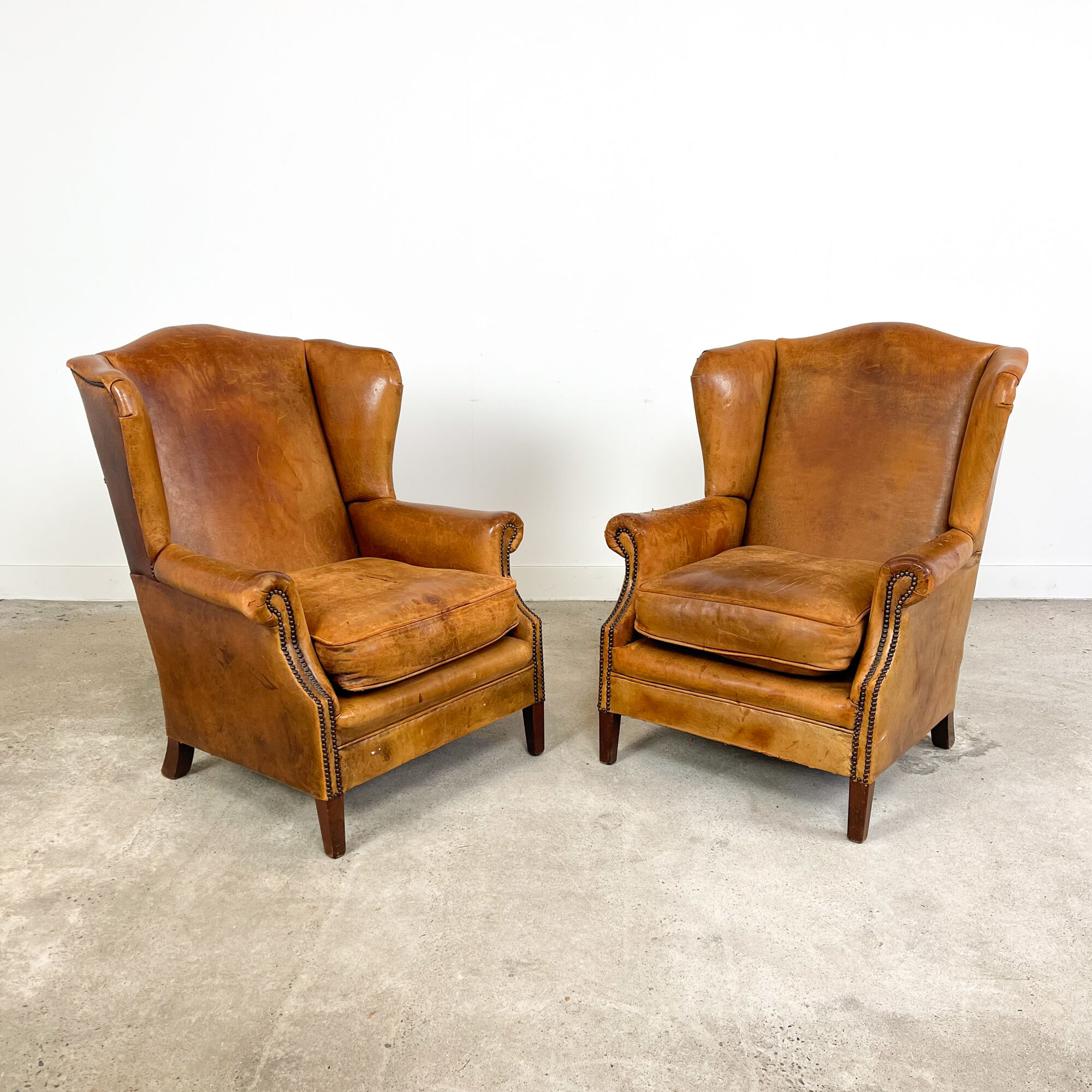 Set of two sheep leather wingback armchairs Delft