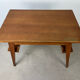 Compass leg desk, 1950s wood reconstitution style.