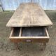 Antique farmhouse table in solid oak with tapered legs and 1 drawer at the end.