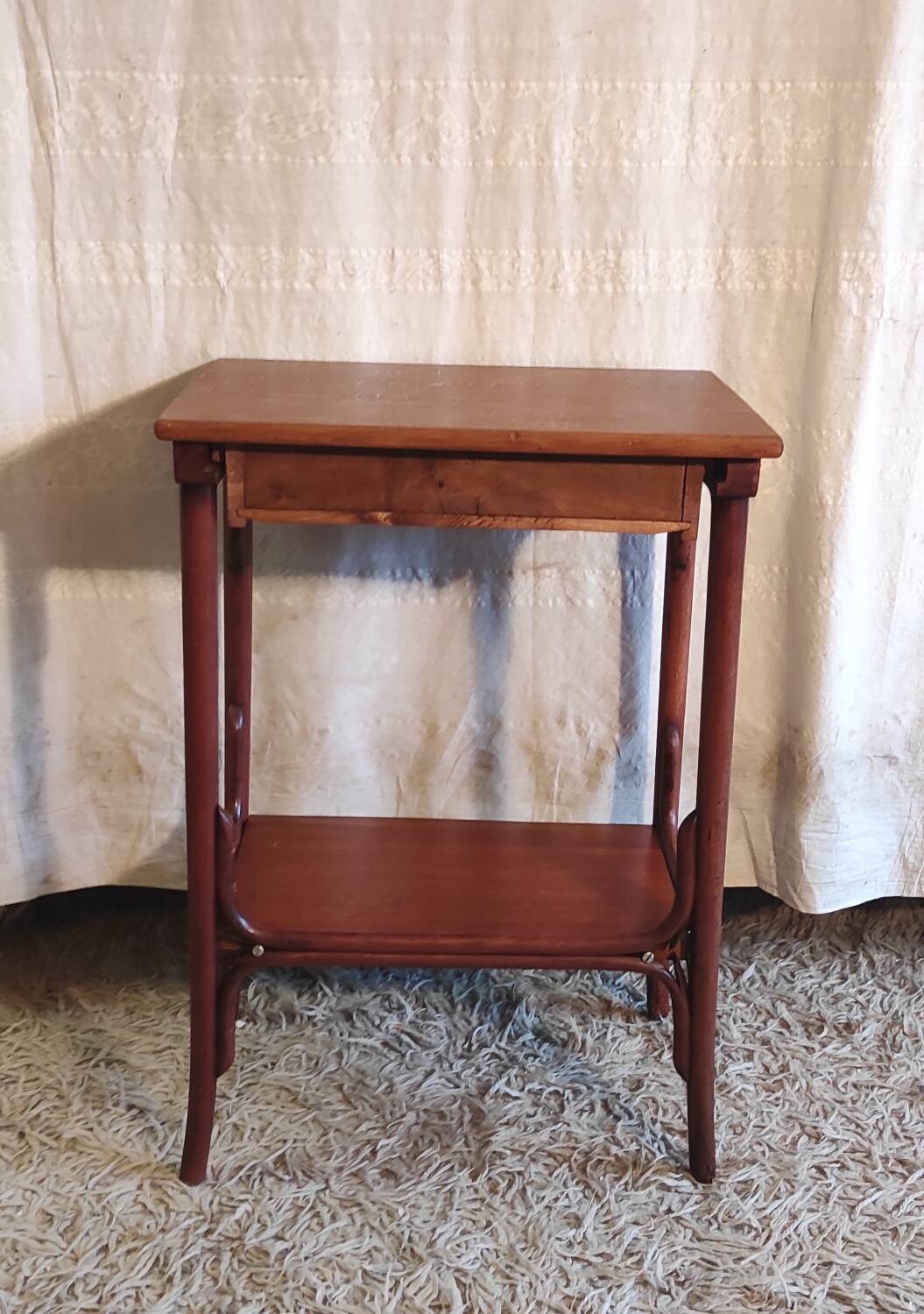 Curved solid wood side table - early 20th century