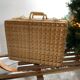 Vintage woven wicker suitcase
