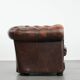 Brown Chesterfield armchair made of cowhide leather in English style
