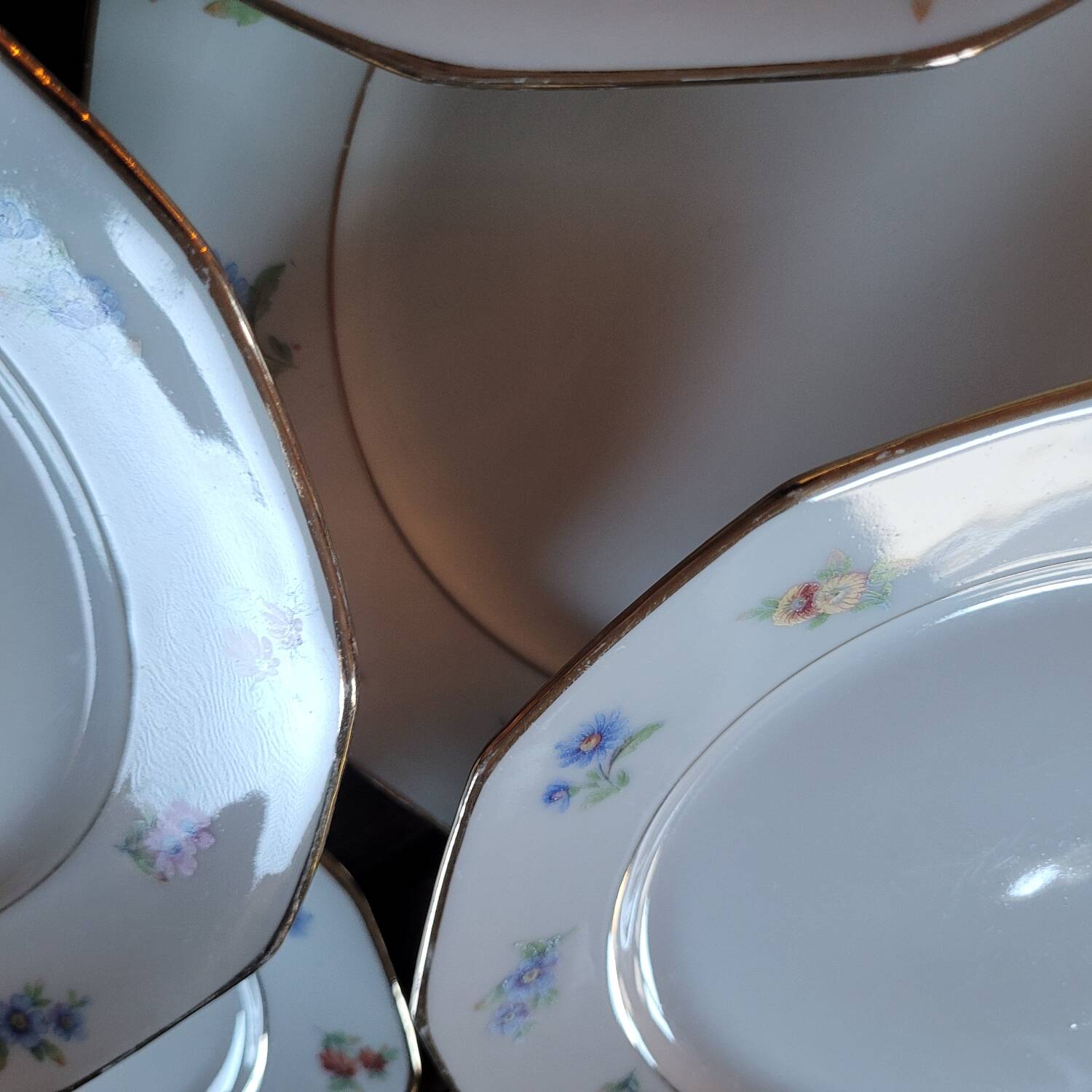 8 porcelain dessert plates with gold rim and various flowers