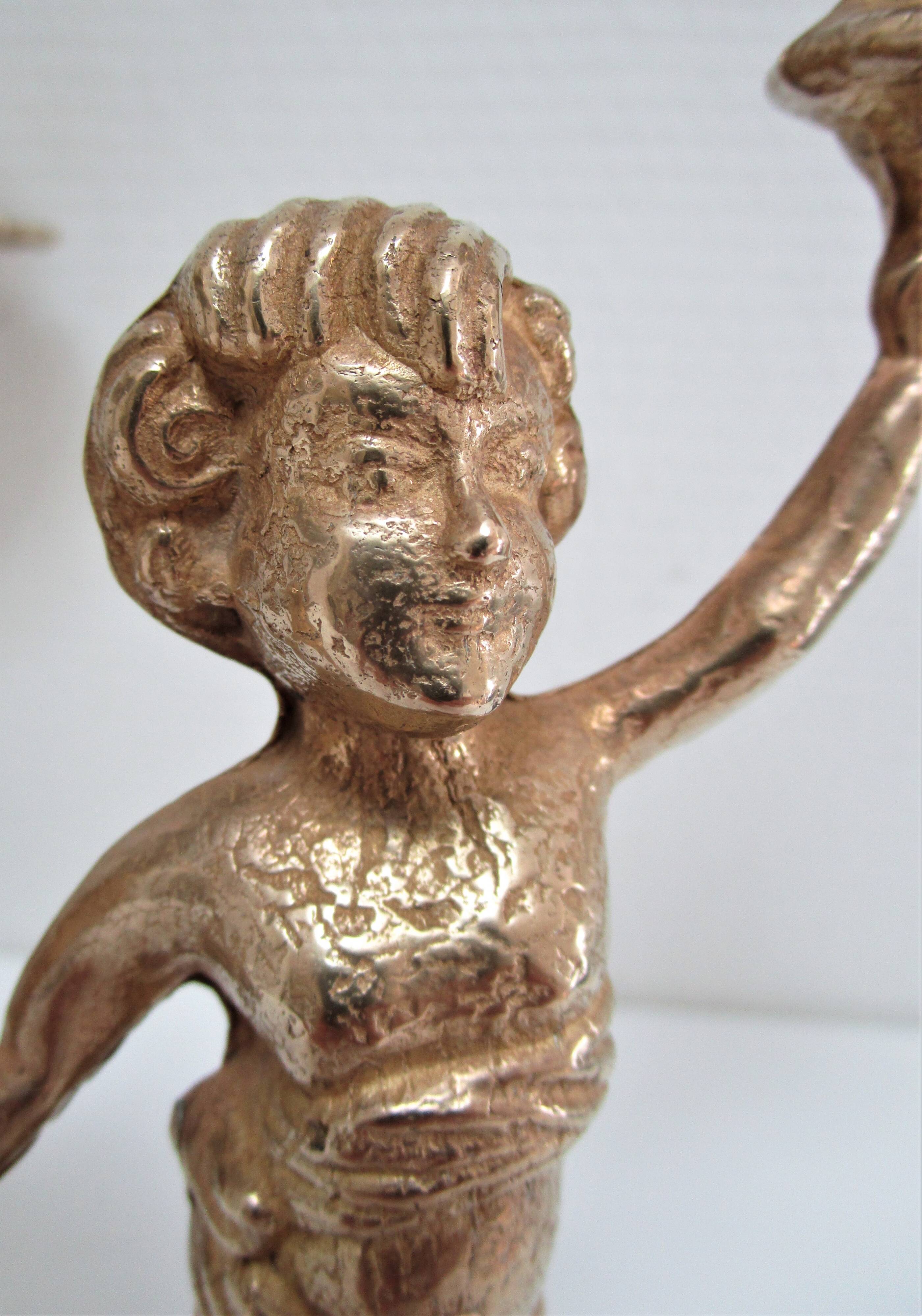 Pair of vintage golden brass cherub candlesticks