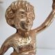 Pair of vintage golden brass cherub candlesticks