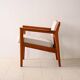 Upholstered armchair with teak frame
