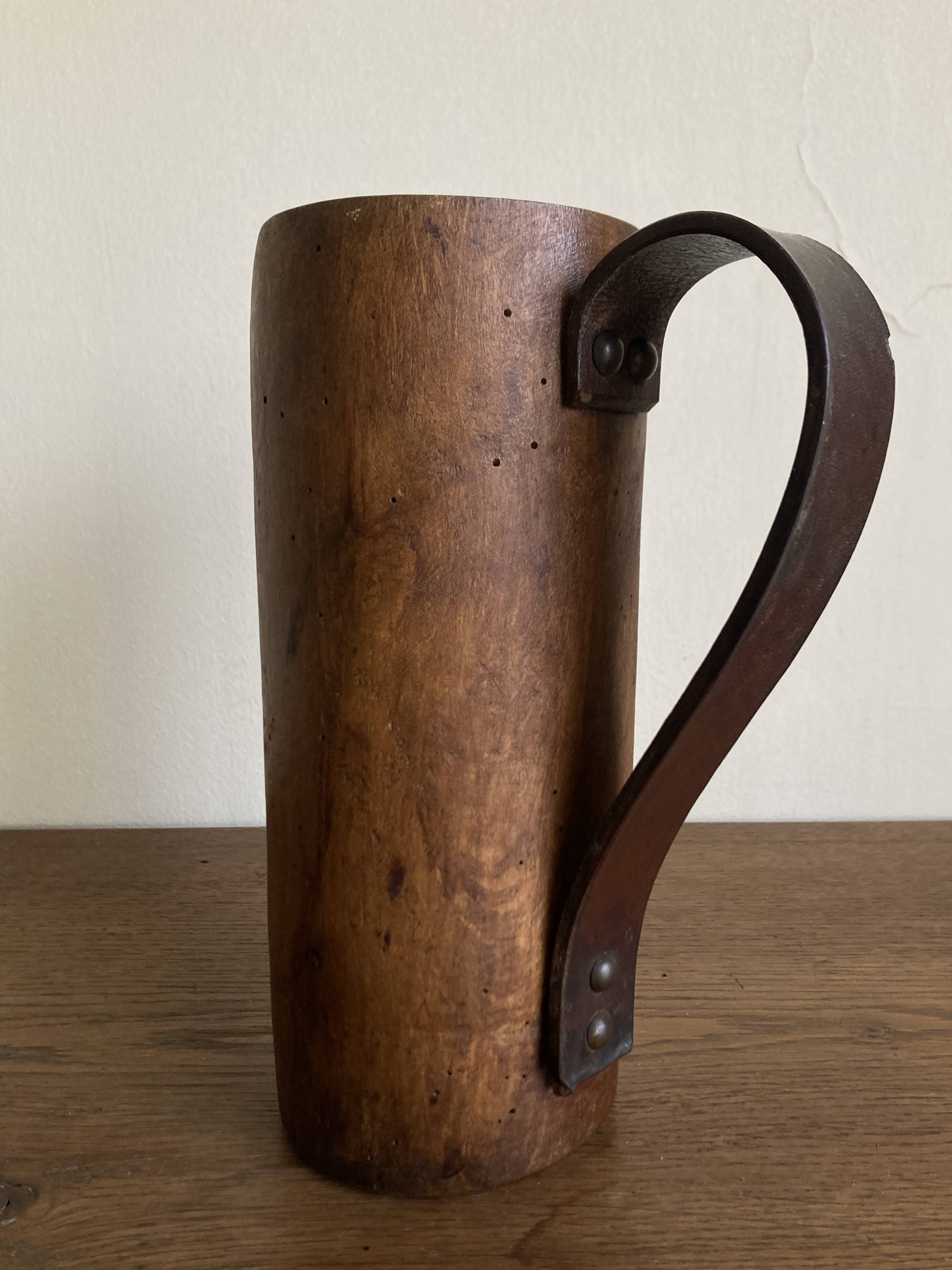 Mountain pitcher in monoxile wood and leather folk art