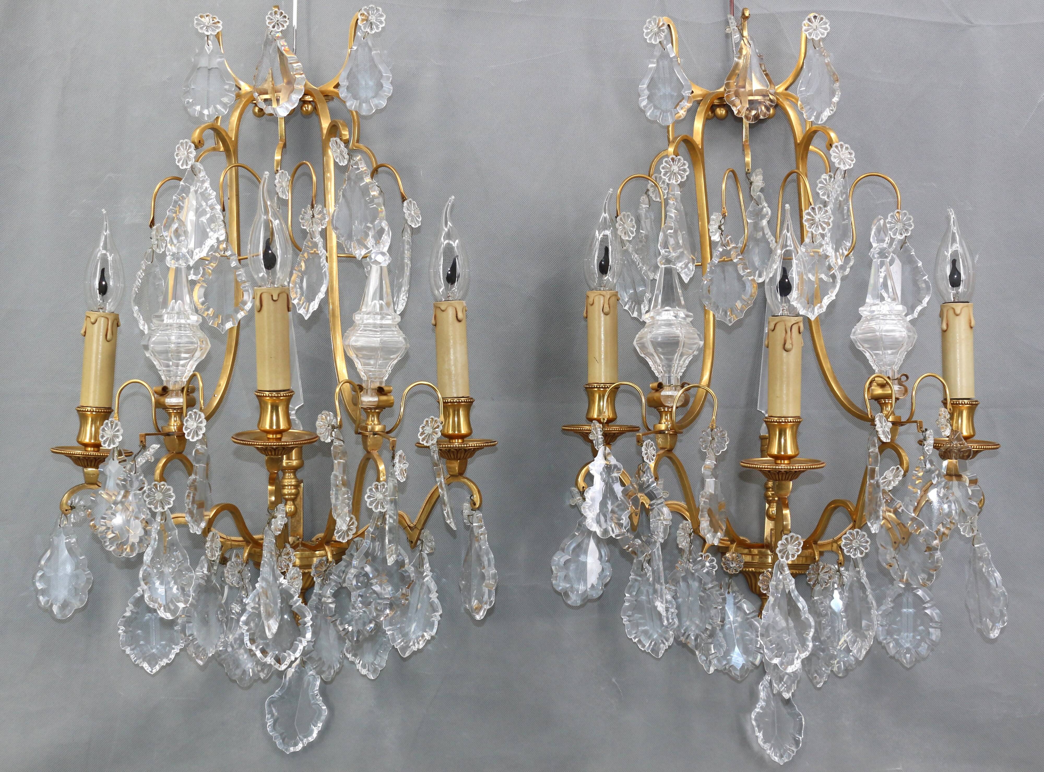 Pair of Louis XVI style gilded bronze & bohemian crystal sconces