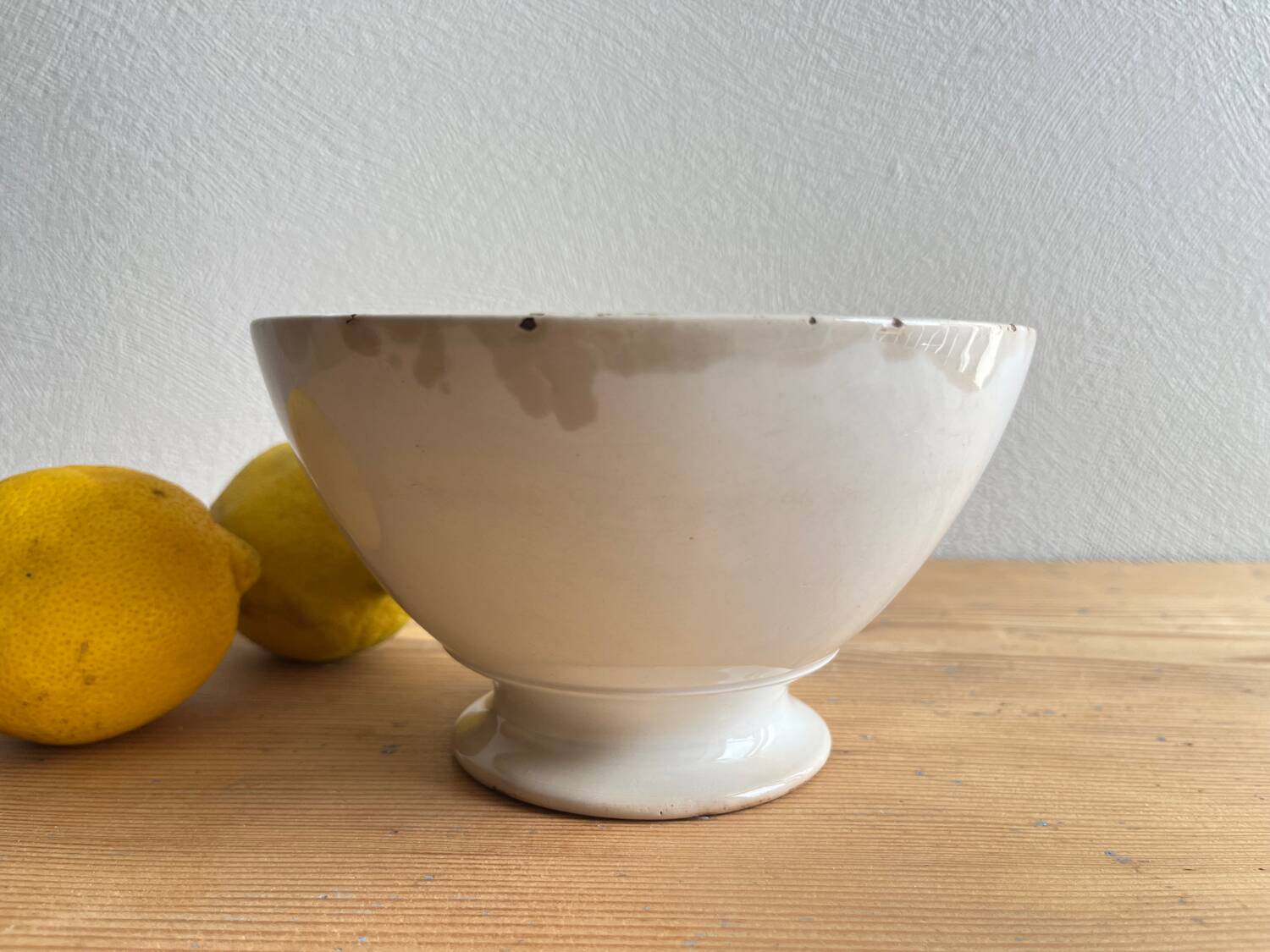 Old earthenware bowl on a pedestal, Badonviller, France.