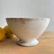 Old earthenware bowl on a pedestal, Badonviller, France.