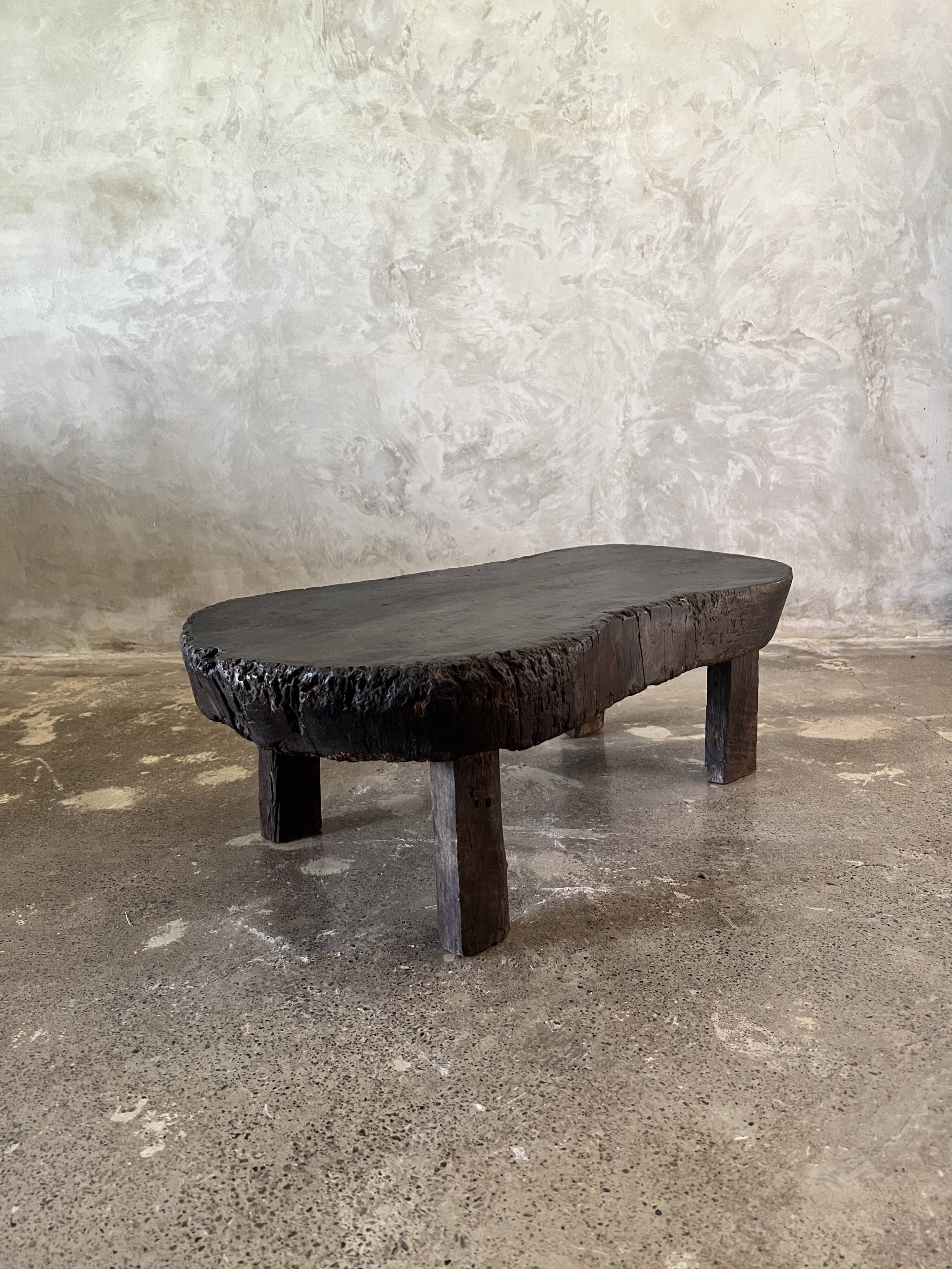 Small old Asian wooden coffee table in Japanese style, kidney-shaped top