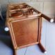 Shelf selette on wooden feet and vintage rattan