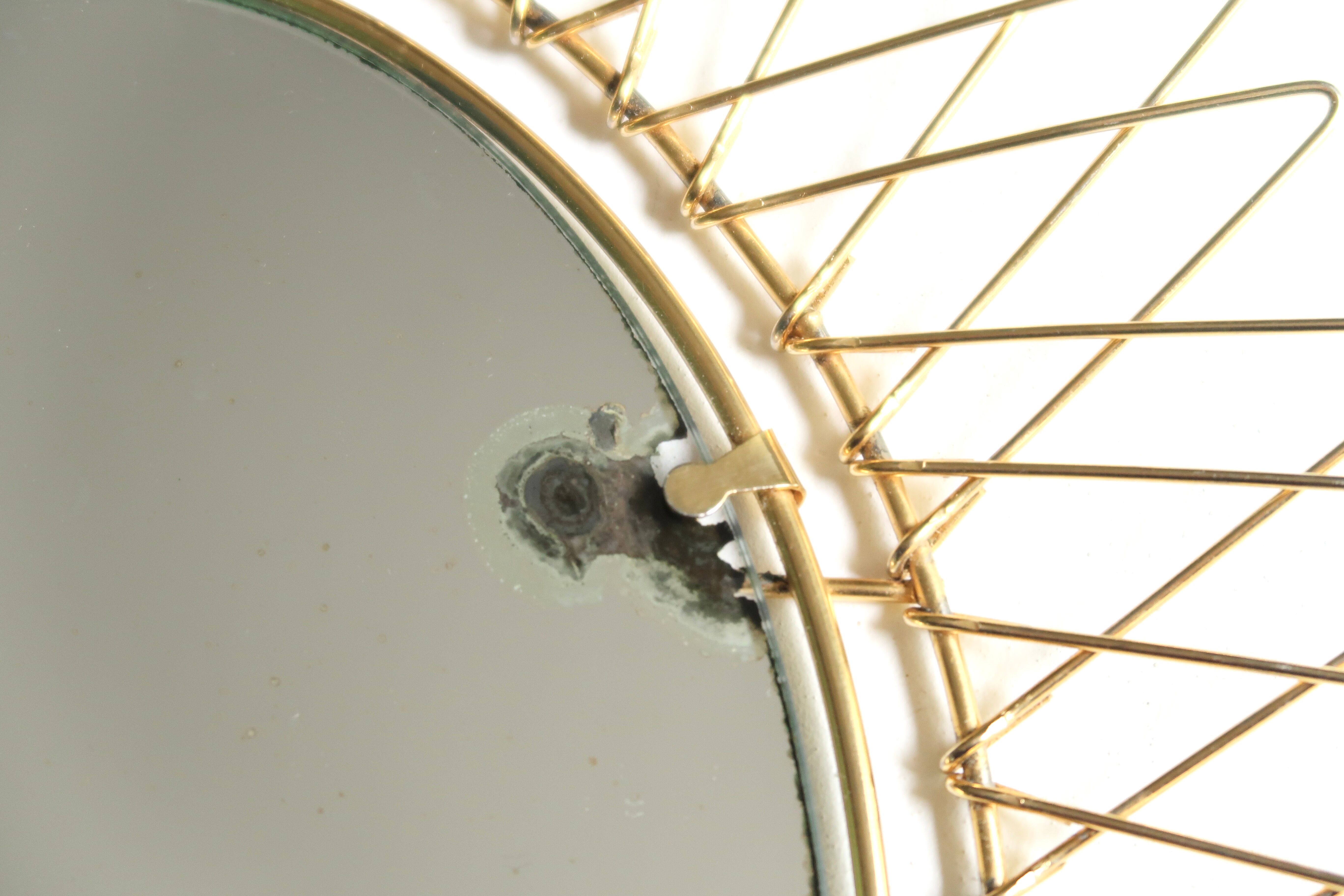 Oval golden sun mirror in metal, 1960s