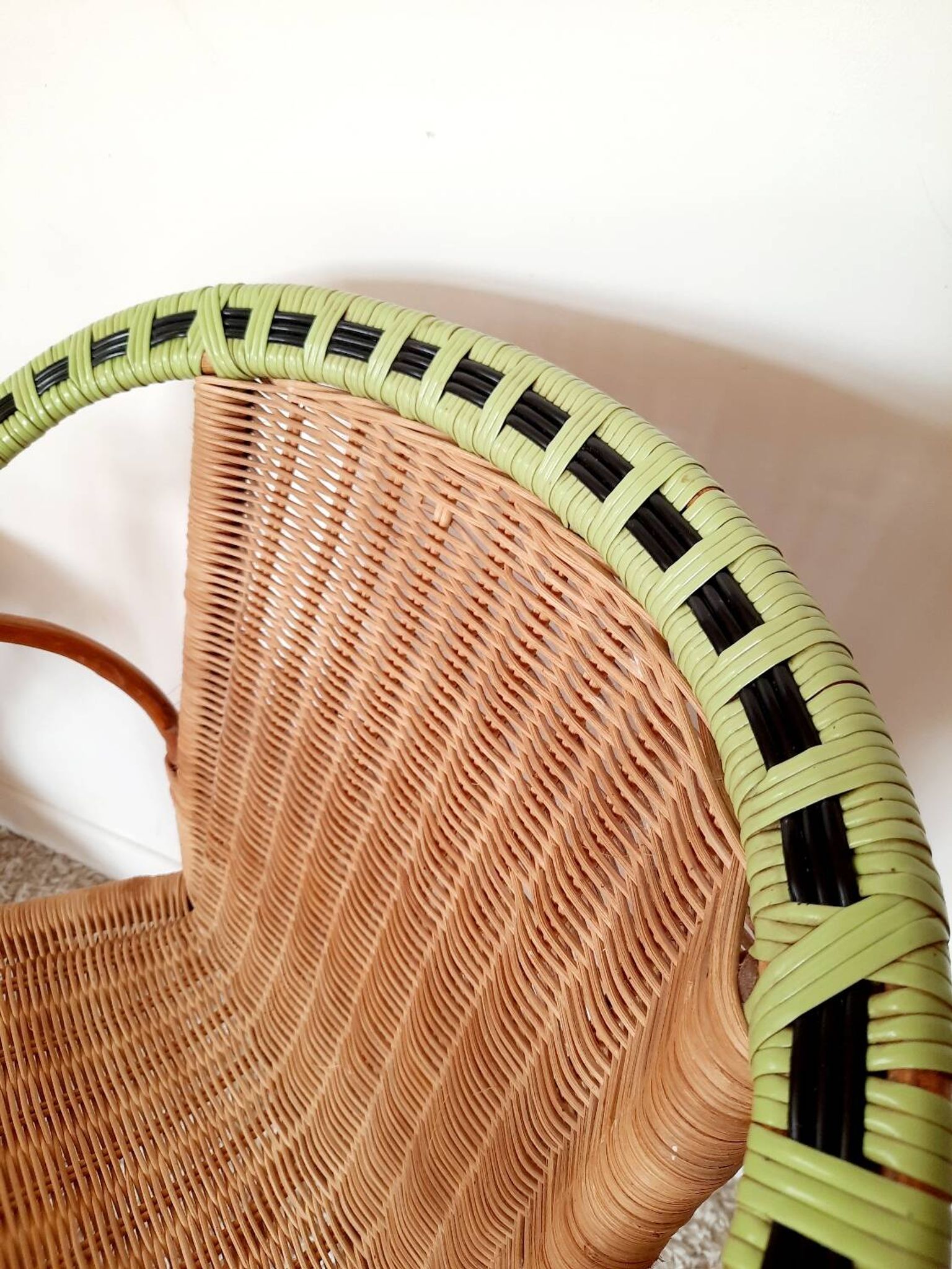 1950s 60s rattan armchair with green apple and black piping.