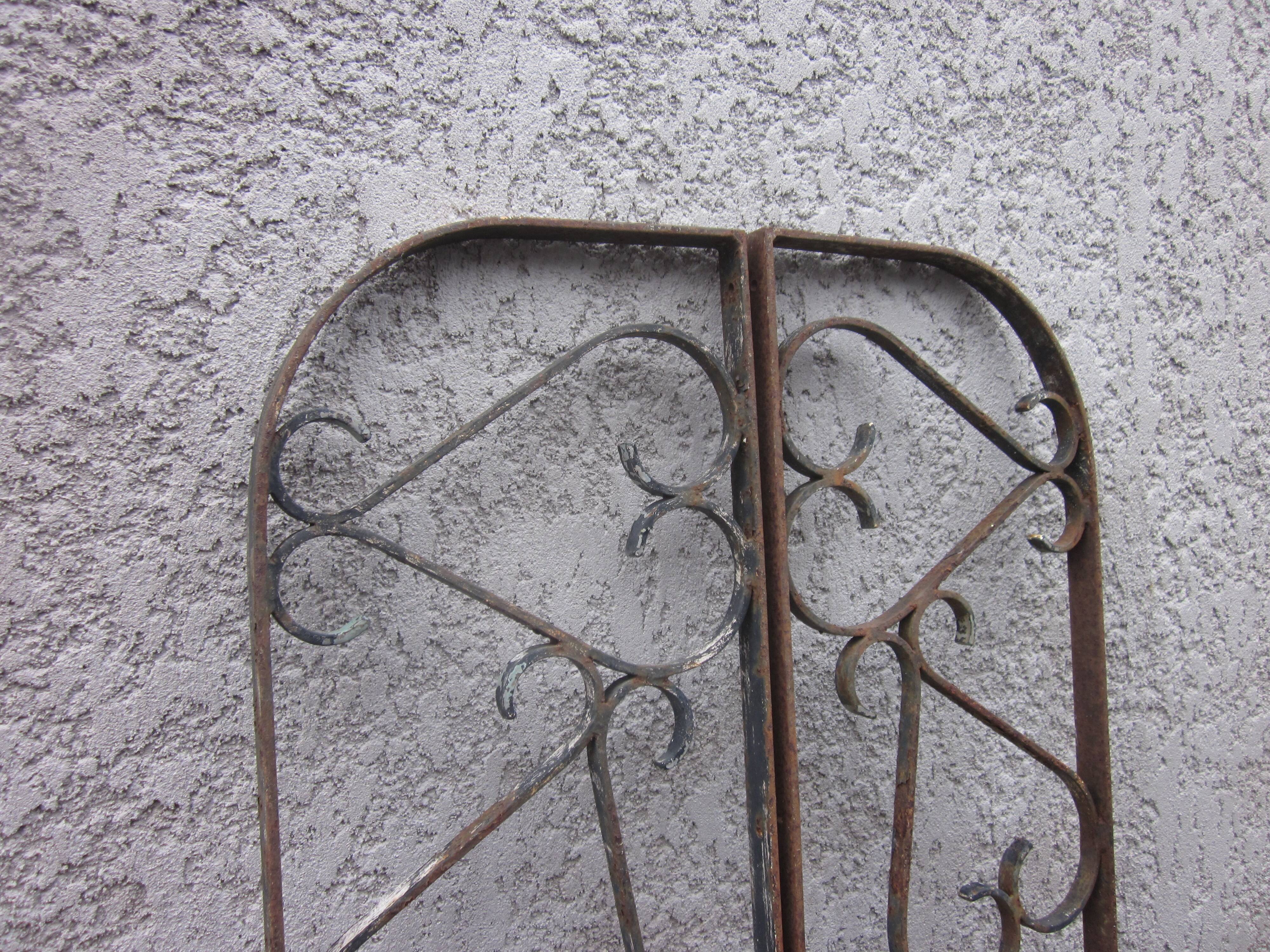 Pair of old wrought iron grid
