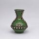 Antique green glazed ceramic vase with relief decoration – Europe
