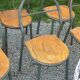 Set of 7 metal chairs by René Herbst with wooden seats.