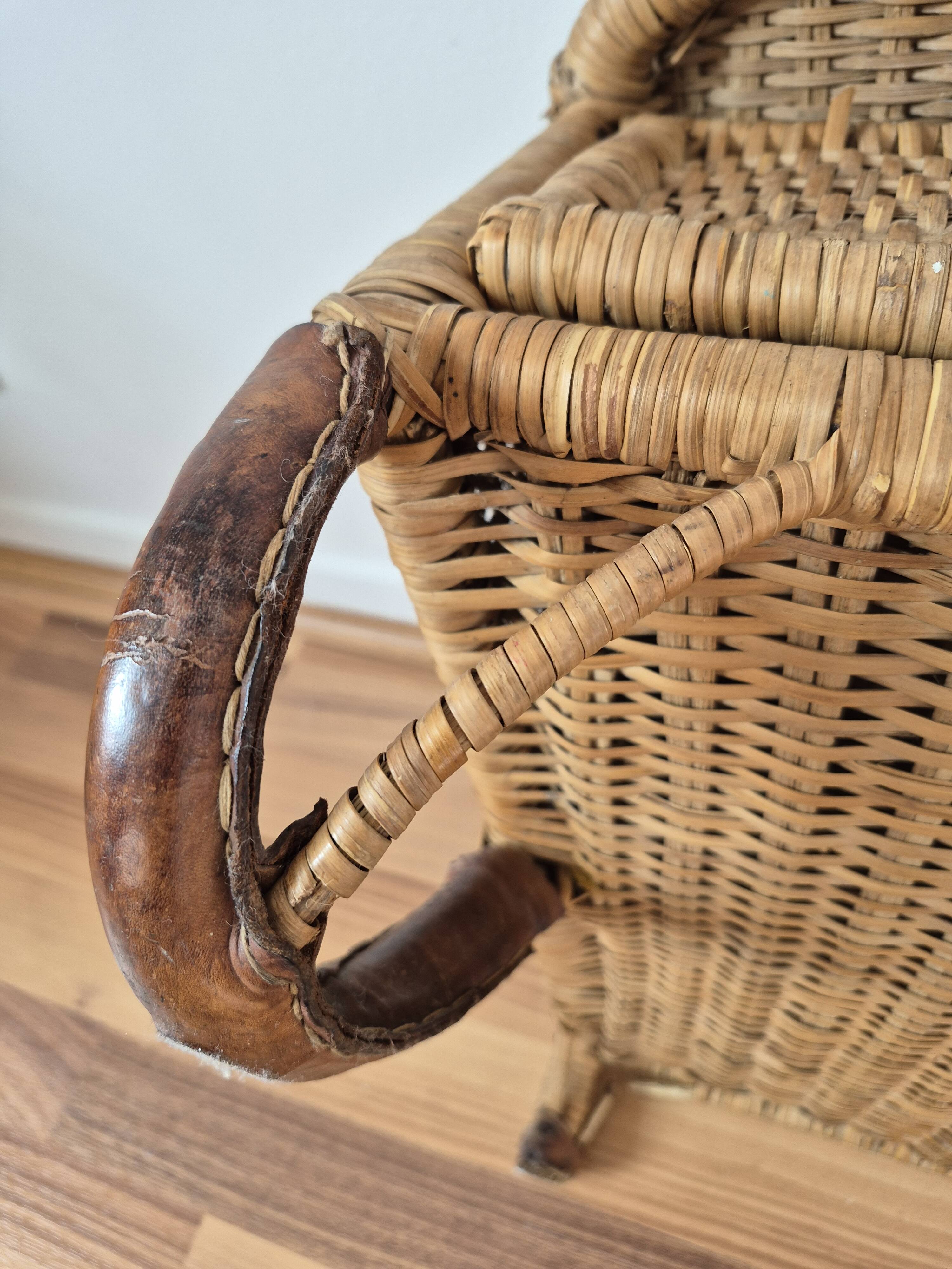 Vintage foldable beach chair, picnic in rattan and leather.