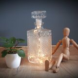 Old whisky carafe in relief glass