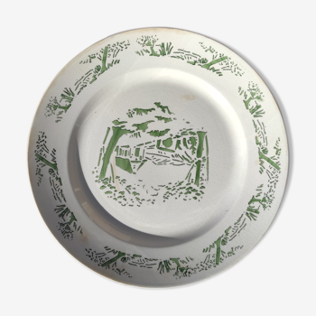 Round dish of Creil and Montereau green color with stamp and hollow mark
