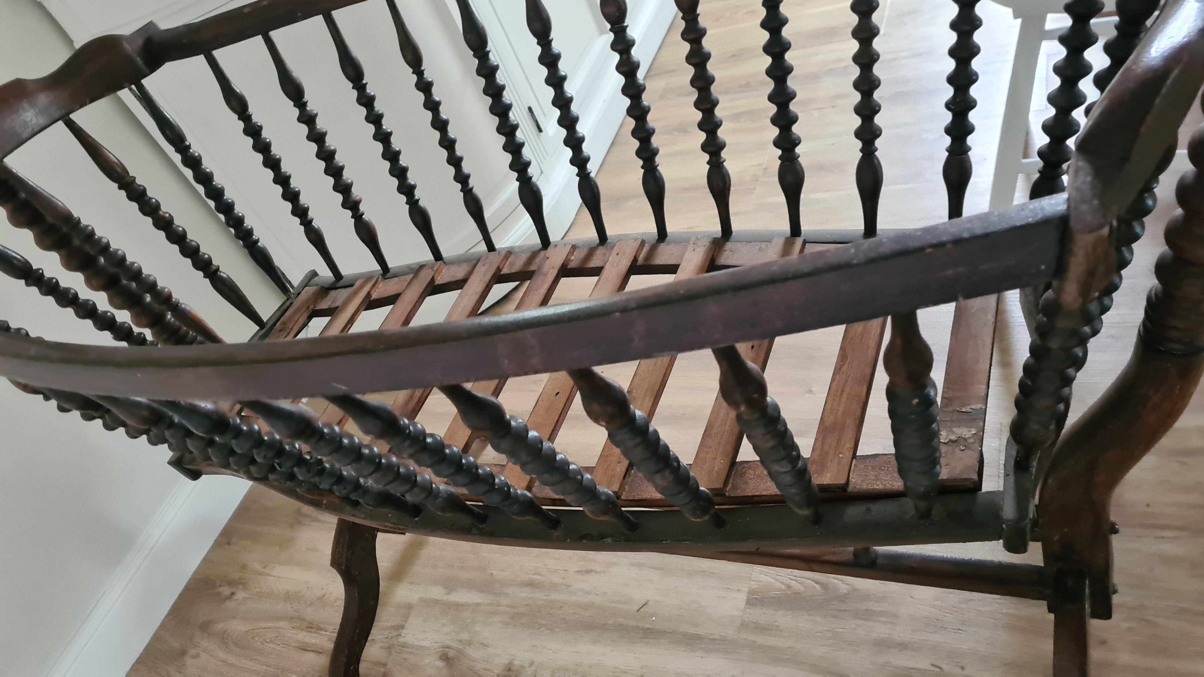 Old wooden rocking cradle twisted / vintage bars